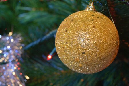 christmas balls on tree with lights and starsの写真素材