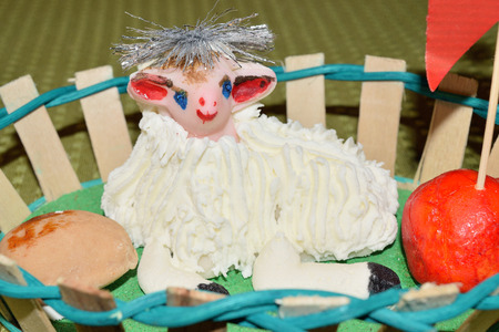 close up of marzipan Easter lamb and fruit in a basketの写真素材