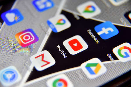 Valverde (CT), Italy - April 04, 2020: Close-up view of YouTube icon app on an Android smartphone, including other icons.のeditorial素材