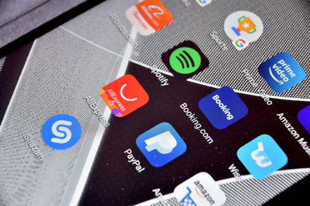 Valverde (CT), Italy - April 12, 2020: Close-up view of Booking.com icon app on an Android smartphone, including other icons.のeditorial素材