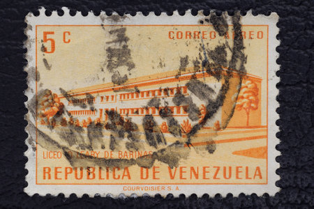 Valverde (CT), Italy - January 15, 2023: an old postage stamp from Venezuela showing the high school o'leary de barinasのeditorial素材
