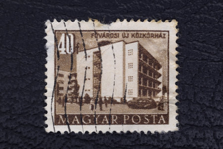 Valverde (CT), Italy - January 15, 2023: An old postage stamp from Hungary showing Public buildingのeditorial素材