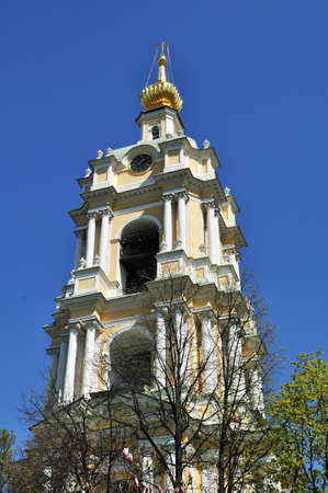Close-up of the bell tower of the monastery. The bell tower against the blue sky. Sunny day.の写真素材