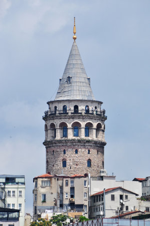 Galata tower close up. People on the observation deck of the tower. July 09, 2021, Istanbul, Turkey.のeditorial素材