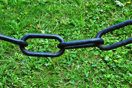 Chain links. Large black painted chain and metal links.の写真素材