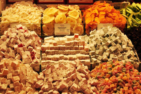 Eastern sweets on the counter. Sale of Turkish delight and candied fruits in the market. 09 July 2021, Istanbul, Turkey.のeditorial素材