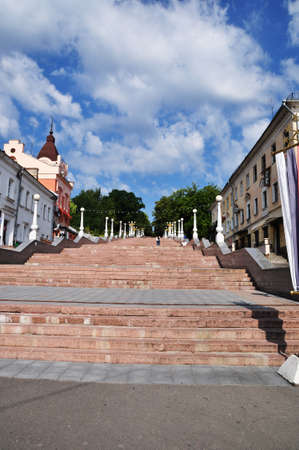 Large city staircase with beautiful lanterns. View of the stairs and old stone houses. July 30, 2021, Bryansk, Russia.のeditorial素材