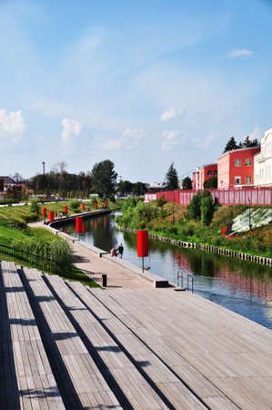 River shore. The Upa River. Sunny autumn day in the city. Wooden stairs to descend to the river.の写真素材