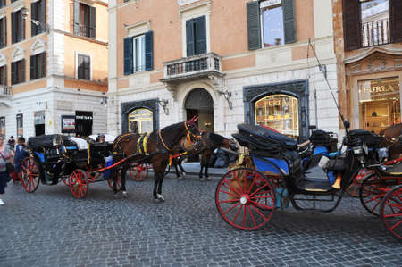 Horse carriages on the streets of Rome. Tourists take walks along the streets in beautiful carriages. June 12, 2019, Rome, Italy.のeditorial素材