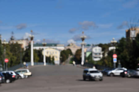 Defocused and blurred background. City street view with cars. Sunny day.の写真素材