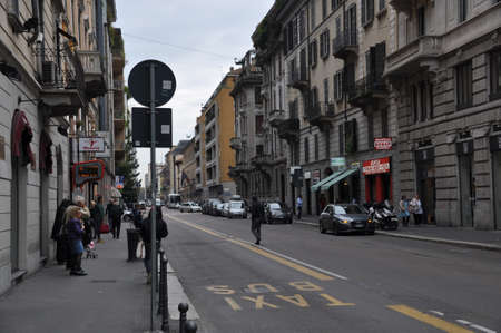 City street panorama. People are standing at the bus stop. October 14, 2014, Milan. Italy.のeditorial素材