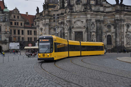 Yellow city tram in Dresden against the background of old houses. October 31, 2013, Dresden, Germany.のeditorial素材