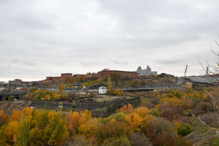 Panoramic view of the city and the Ararat brandy factory in Yerevan. On the roof of the building there is an inscription in Armenian and Russian. YEREVAN BRANDY FACTORY. November 11, 2021, Yerevan, Armenia.のeditorial素材