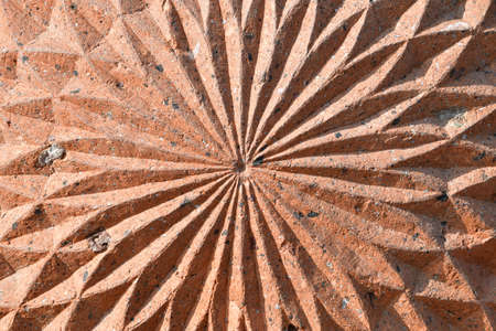Figured stone carving. Background, texture of stone. Patterns diverge from the center.の写真素材