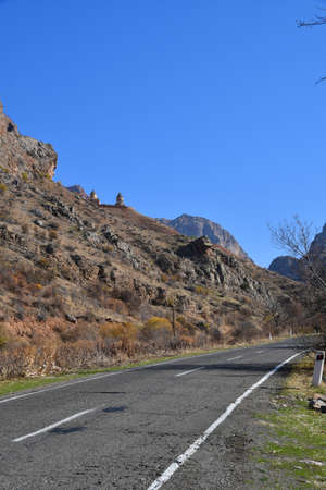 Panoramic view of the monastery in the mountains. The road in the mountains against the background...
