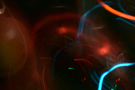 Abstract multicolored stripes in blue and red on a blurred background. Bokeh.