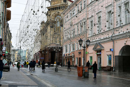 Panorama of the city street. The old bank building. On the facade of the building there is an inscription BANK in Russian. February 11, 2022, Moscow, Russia.のeditorial素材