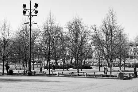 black and white photography. Panoramic view of the Alexander Garden and people walking in the garden. 03.24. 2022 Moscow, Russia.のeditorial素材