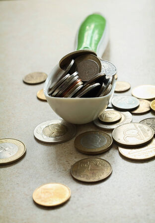 Spoon full of moneyの写真素材