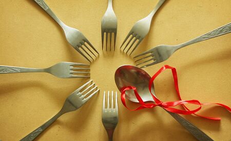 Leadership concept with forks and spoon