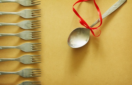 Leadership concept with forks and spoonの写真素材