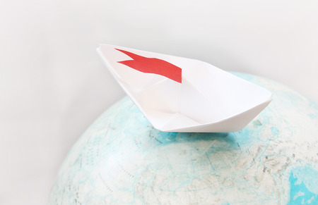 Travel concept with paper boatの写真素材
