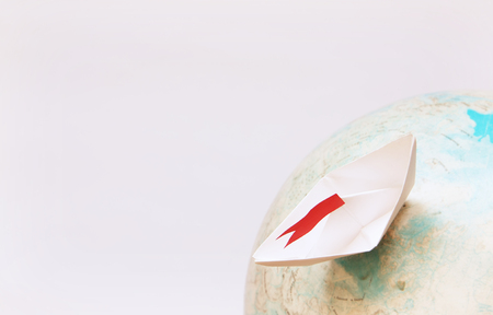 Travel concept with paper boatの写真素材