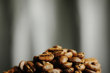 Beautiful background with scattered coffee beansの写真素材