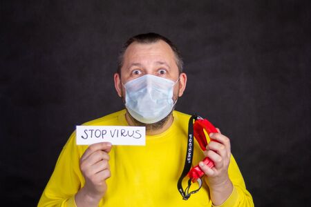 A man wearing a yellow shirtの写真素材