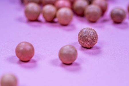 A pile of oranges sitting on top of a wooden tableの写真素材
