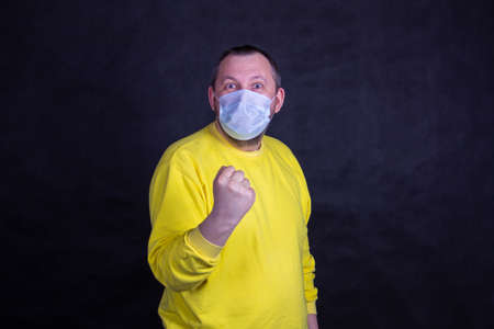 A man in a yellow shirtの写真素材