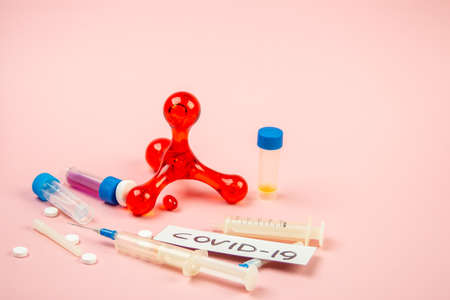 Covid-19, medical instruments, syringe and colorful medicinesの写真素材