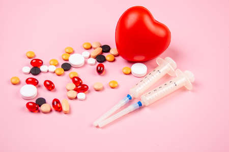 Covid-19, medical instruments, syringe and colorful medicines