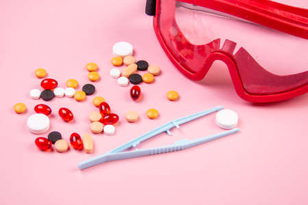 Covid-19, medical instruments, syringe and colorful medicines