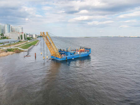 The crane ship carries out the rise of the sunken vessel from the bottomの写真素材