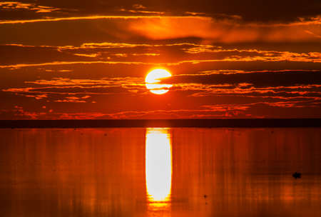 A sunset over a body of water