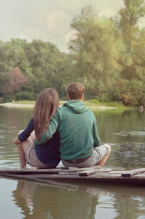 Loving couple on the river bankの写真素材