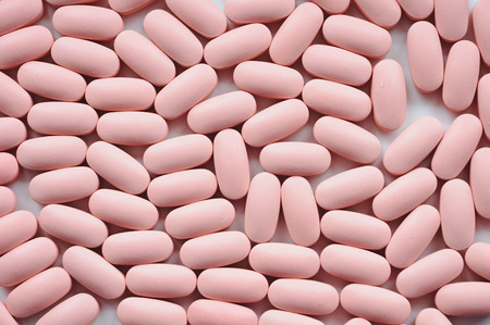 Soft pink medical pills, tablets, capsules backgroundの写真素材
