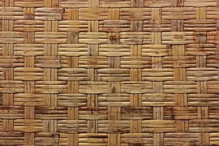 Background texture from dry woven bamboo wood color の写真素材