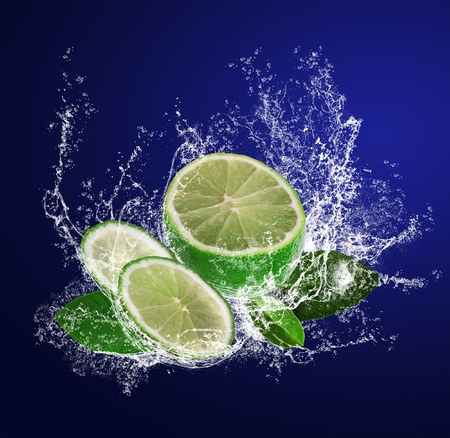 Abstract background with sliced lime in water drops