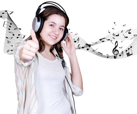Happy Teenage girl in headphones on white background with music signsの写真素材
