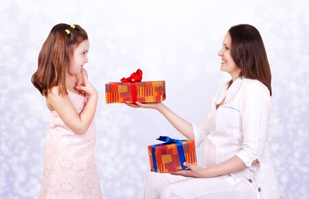 Pregnant mother prepear gifts for her daughter. Brother or sister?の写真素材