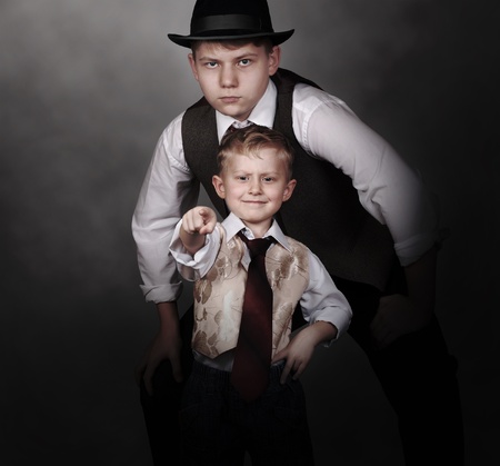 Older brother protect his yonger brother  Little bossの写真素材