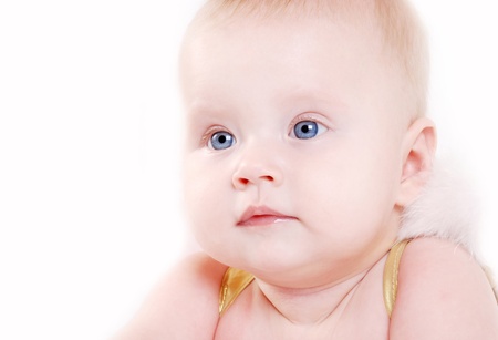 Close up portrait baby girl with angel wings over white backgroundの写真素材