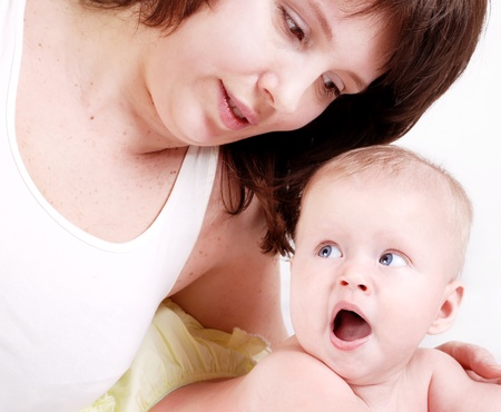 Close up portrait baby girl with motherの写真素材