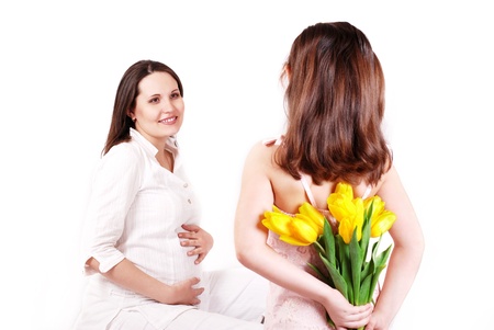 Yellow tulips like surprise for pregnant mom from her little daughter の写真素材