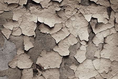 Background with old cracky paint on the stone wall