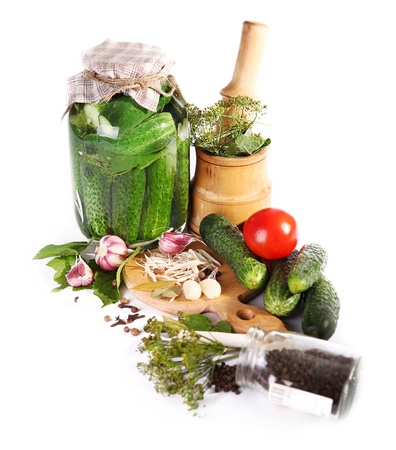 Pickled and fresh cucumbers, tomatoes, herbs and spices preparing for canned の写真素材