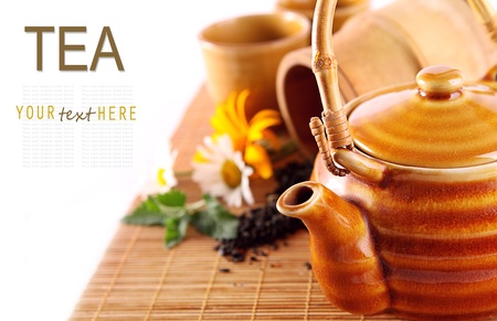 Background with chenese teapot on the bamboo coverの写真素材