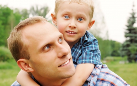 Portrait little son and his father at the outdoorの写真素材